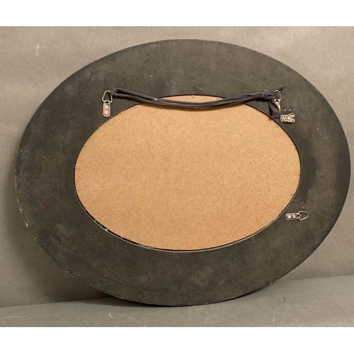 310 - A distressed oval hall mirror with a faceted glass border 77x60