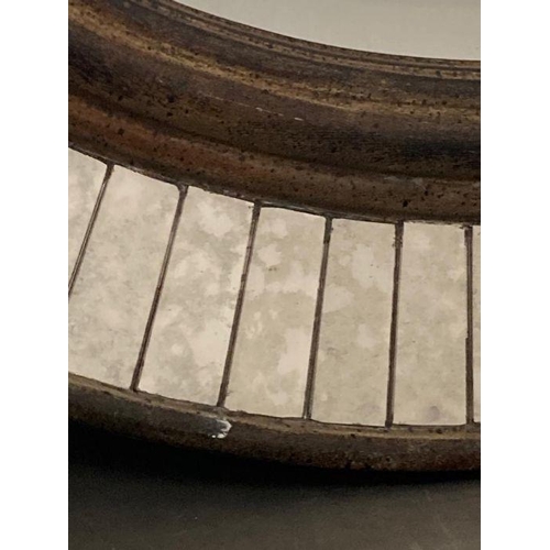 310 - A distressed oval hall mirror with a faceted glass border 77x60