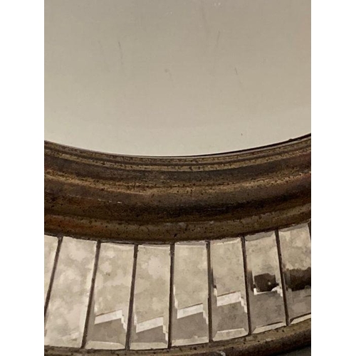310 - A distressed oval hall mirror with a faceted glass border 77x60