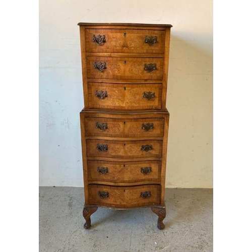 40 - A dark oak wheel back arm chair
