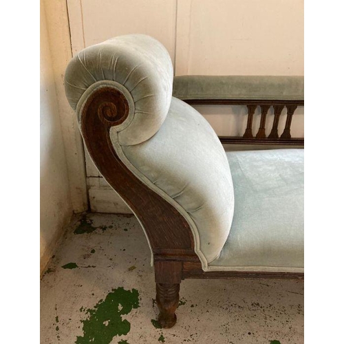 82 - An oak framed light blue upholstered chaise longue (H75cm W160cm D60cm)