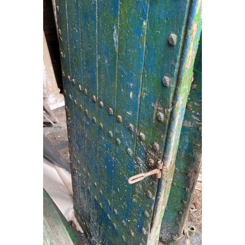 101 - Four oak studded reclaimed doors, possibly 17th century (H206cm W77cm D9cm)