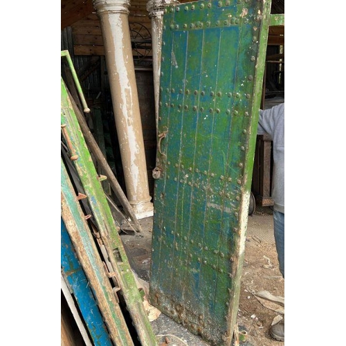 101 - Four oak studded reclaimed doors, possibly 17th century (H206cm W77cm D9cm)