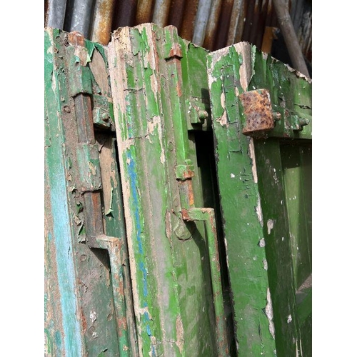 101 - Four oak studded reclaimed doors, possibly 17th century (H206cm W77cm D9cm)