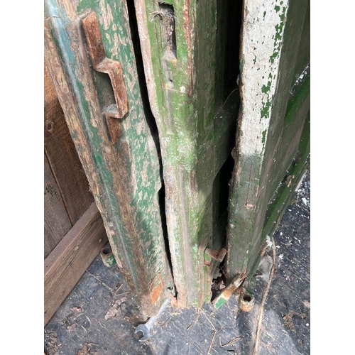 101 - Four oak studded reclaimed doors, possibly 17th century (H206cm W77cm D9cm)