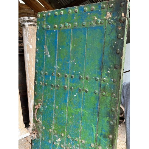 101 - Four oak studded reclaimed doors, possibly 17th century (H206cm W77cm D9cm)