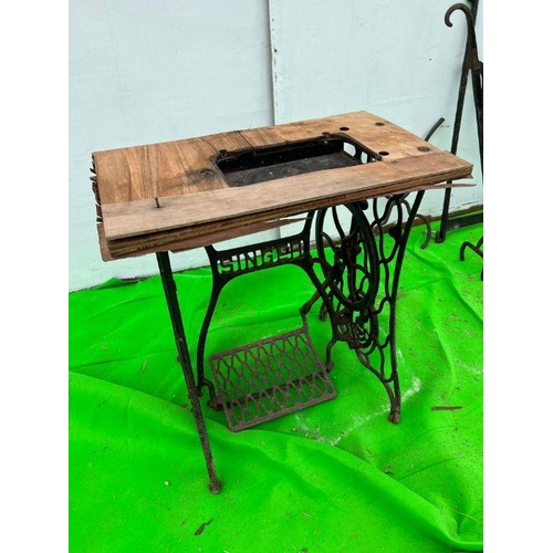 102 - A collection of iron manager Singer sewing machine stand