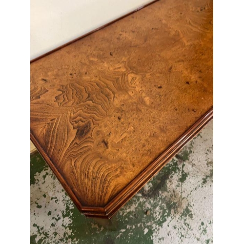 112 - A flamed mahogany coffee table