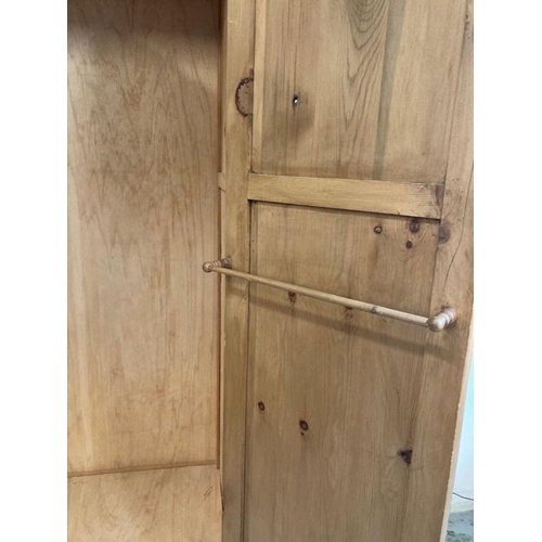 127 - A two door pine wardrobe with drawer under (H200cm W95cm D66cm)