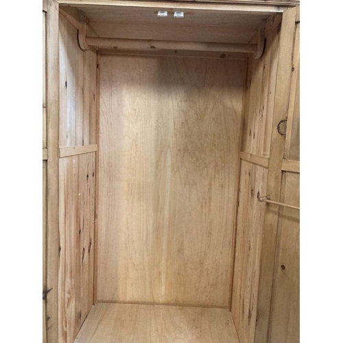 127 - A two door pine wardrobe with drawer under (H200cm W95cm D66cm)