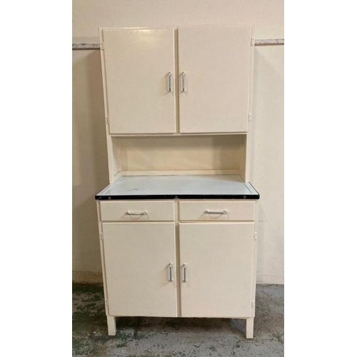 131 - A white painted Mid Century kitchen unit with metal work top, two drawers and two cupboards over and... 