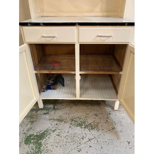 131 - A white painted Mid Century kitchen unit with metal work top, two drawers and two cupboards over and... 