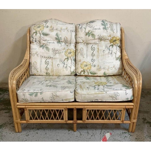 138 - A bamboo three piece conservatory suite consisting of a two seater sofa and two arm chairs