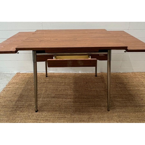 144 - A Mid Century Formica 60's table with extensions to sides by Super Mac Le Tubrnenage H77cm W137cm D6... 