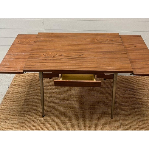 144 - A Mid Century Formica 60's table with extensions to sides by Super Mac Le Tubrnenage H77cm W137cm D6... 