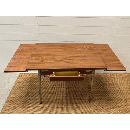 144 - A Mid Century Formica 60's table with extensions to sides by Super Mac Le Tubrnenage H77cm W137cm D6... 