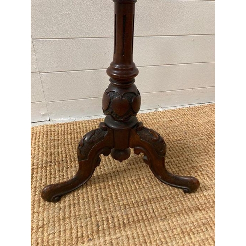 145 - A burr walnut oval pedestal side table on tripod legs