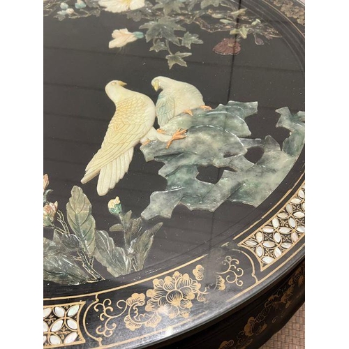 146 - A Chinese black lacquer coffee table (H47cm Dia76cm)