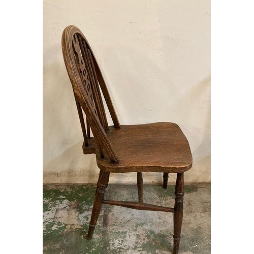 147 - Four oak vintage wheel back dining chairs