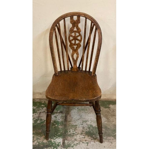 147 - Four oak vintage wheel back dining chairs