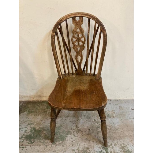 148 - Four oak vintage wheel back dining chairs