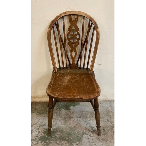 149 - Four oak vintage wheel back dining chairs