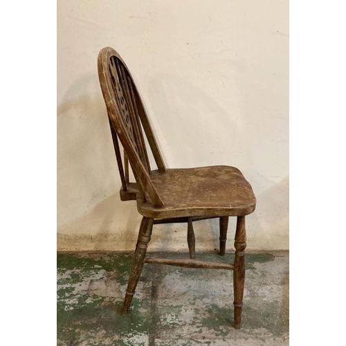 150 - Four oak vintage wheel back dining chairs