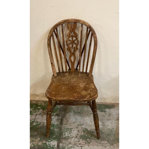 150 - Four oak vintage wheel back dining chairs