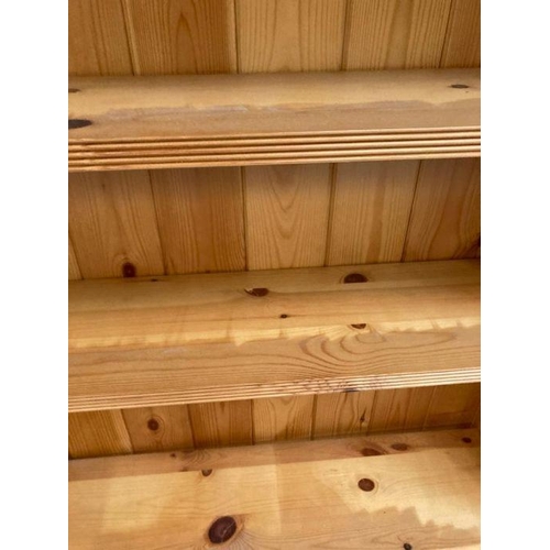 157 - A pine four shelf bookcase (H108cm W120cm D23cm)