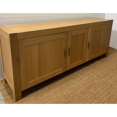 159 - A large light oak sideboard with chrome handles (H90cm W226cm D53cm)