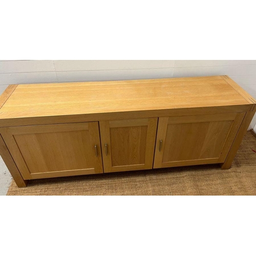 159 - A large light oak sideboard with chrome handles (H90cm W226cm D53cm)