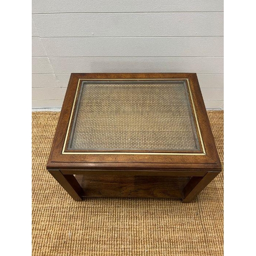 171 - A square coffee table with glass and rattan top