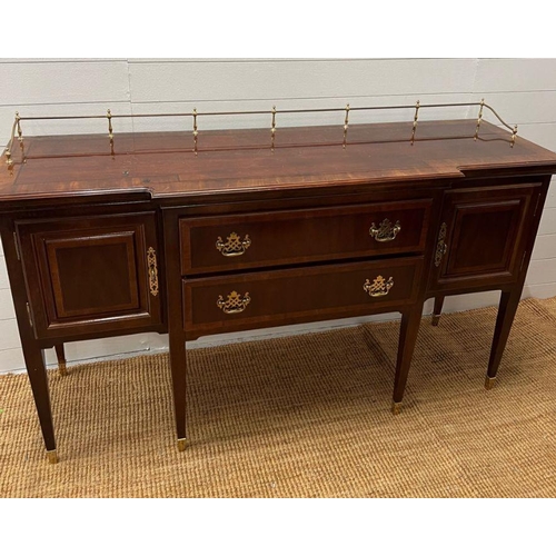 178 - A Sheraton style sideboard with raised brass gallery back, flanked with cupboards and drawers (H90cm... 