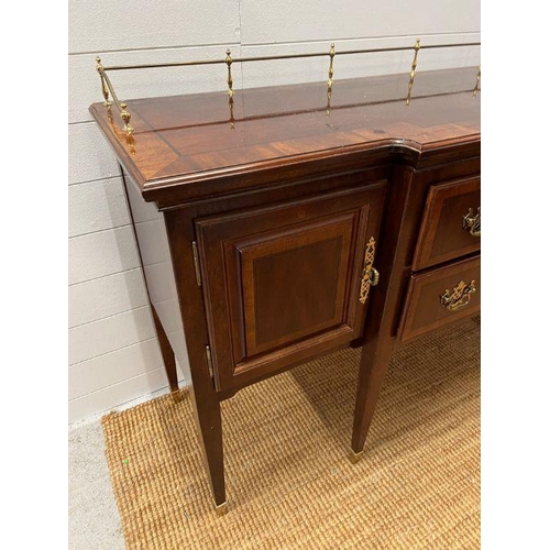 178 - A Sheraton style sideboard with raised brass gallery back, flanked with cupboards and drawers (H90cm... 