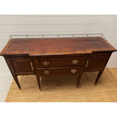 178 - A Sheraton style sideboard with raised brass gallery back, flanked with cupboards and drawers (H90cm... 