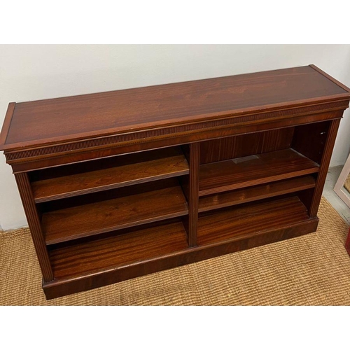 179 - A mahogany double open bookcase stand upon a plinth base (H92cm W52cm D35cm)