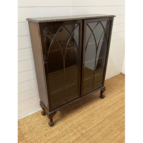 180 - An oak slim display cabinet on ball and claw feet (H114cm W90cm D28cm)