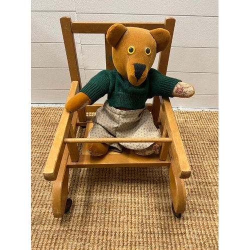 190 - A vintage child's walker chair along with a teddy bear