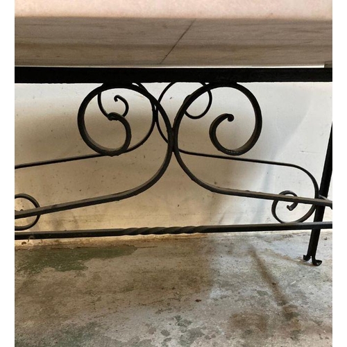 2 - A wrought iron coffee table with polished marble top