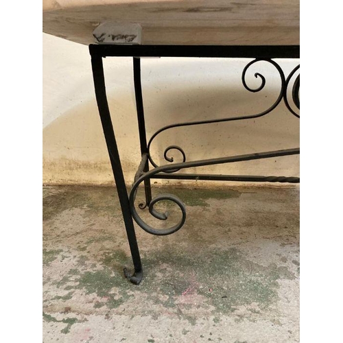2 - A wrought iron coffee table with polished marble top