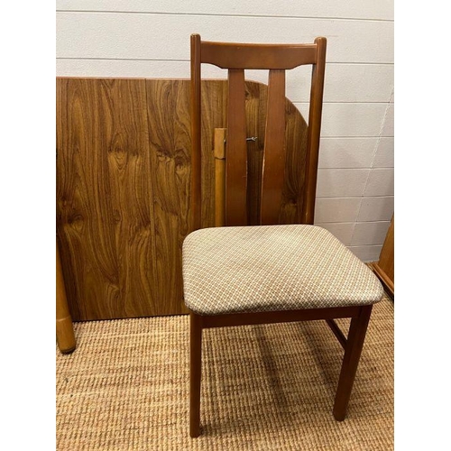 211 - A Mid Century Formica table with four chairs