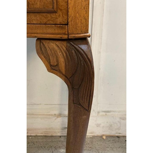 215 - A burr walnut single drawer side table on carved cabriole legs (H72cm W62cm D44cm)