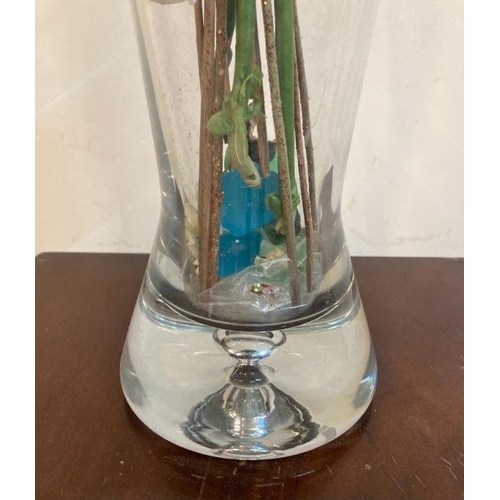 22 - A heavy bottomed clear glass vase with faux flowers (H60cm)