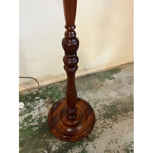 238 - A mahogany turned floor standing lamp