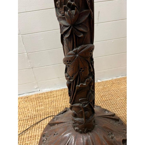 246 - A carved floor standing lamp