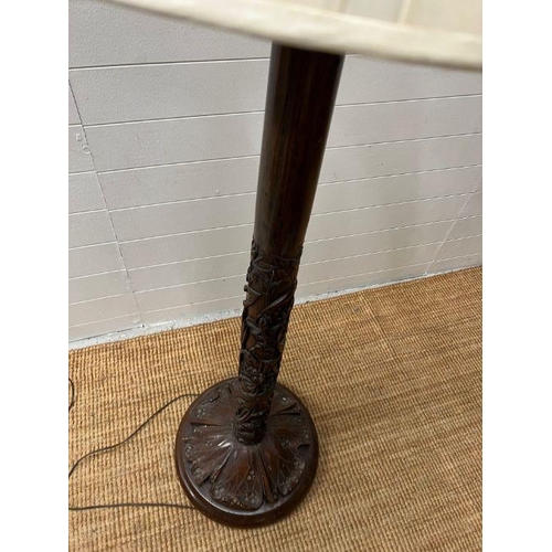 246 - A carved floor standing lamp