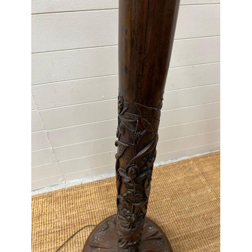 246 - A carved floor standing lamp