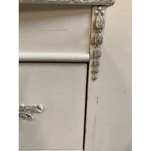 26 - A white painted four drawer Louis style chest of drawers