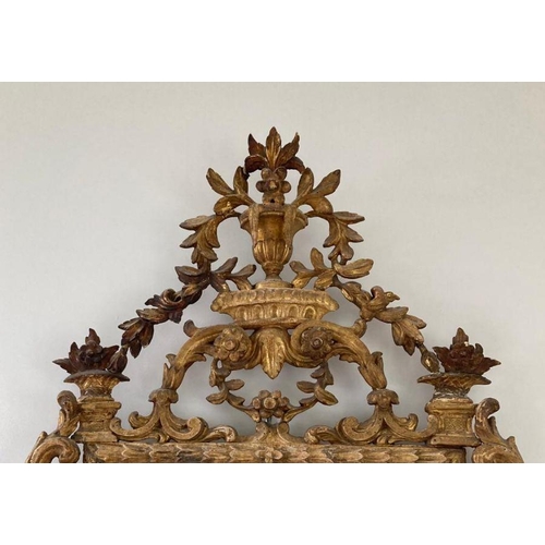 262 - An 19th Century carved gilt mirror with urn of flowers and full scroll