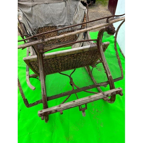 263 - A wooden and woven original sledge carriage (H125cm W220cm D140cm)